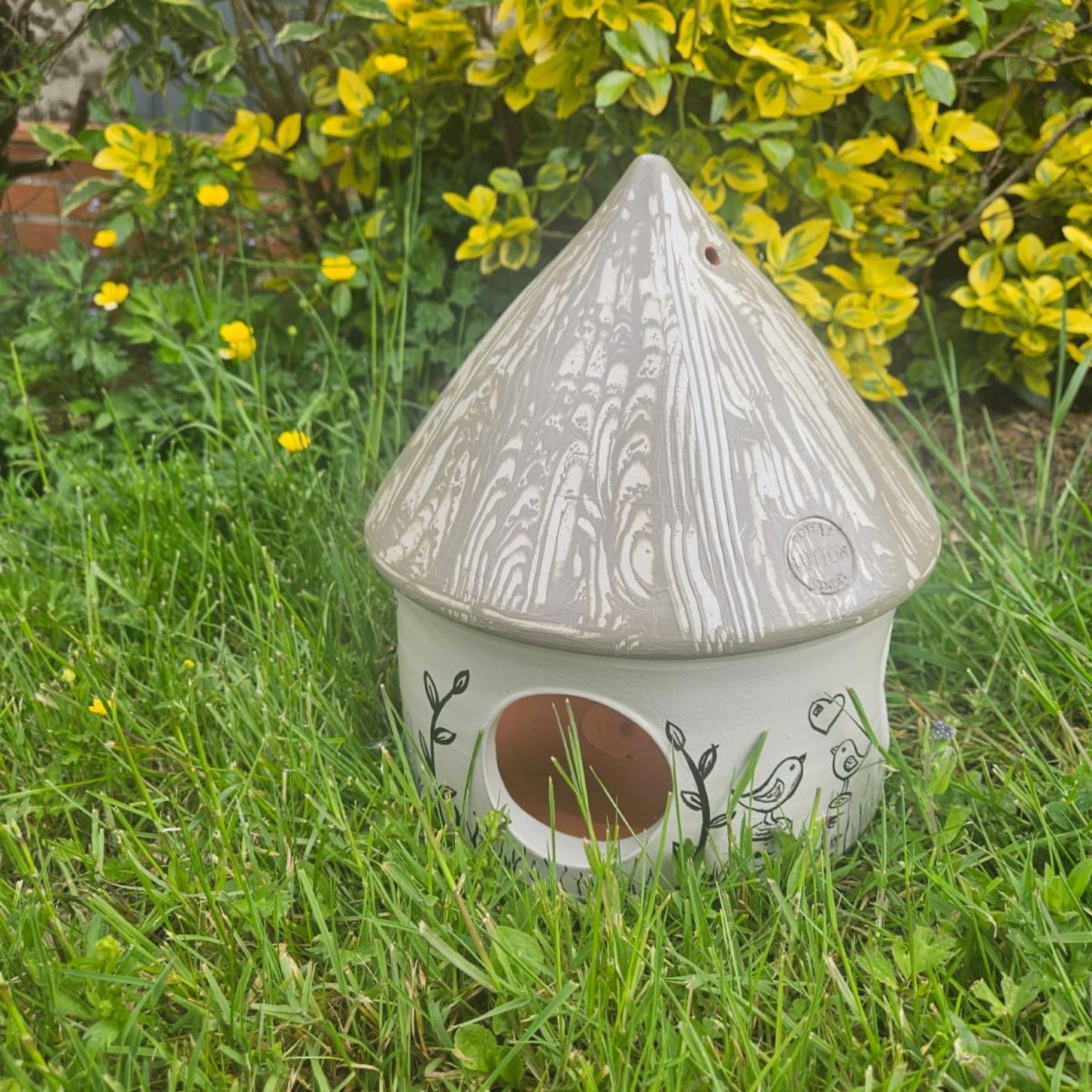 Mangeoire artisanale pour oiseaux en poterie