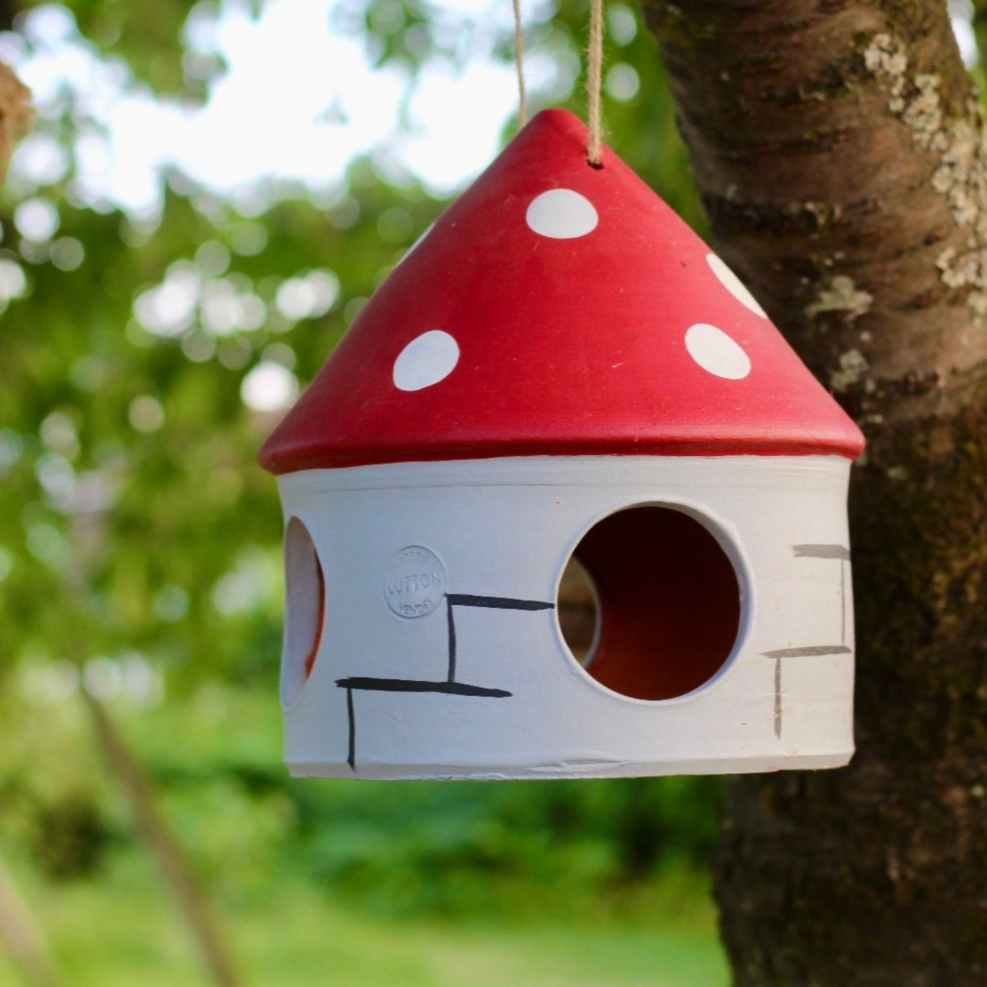 Mangeoire artisanale pour oiseaux en poterie